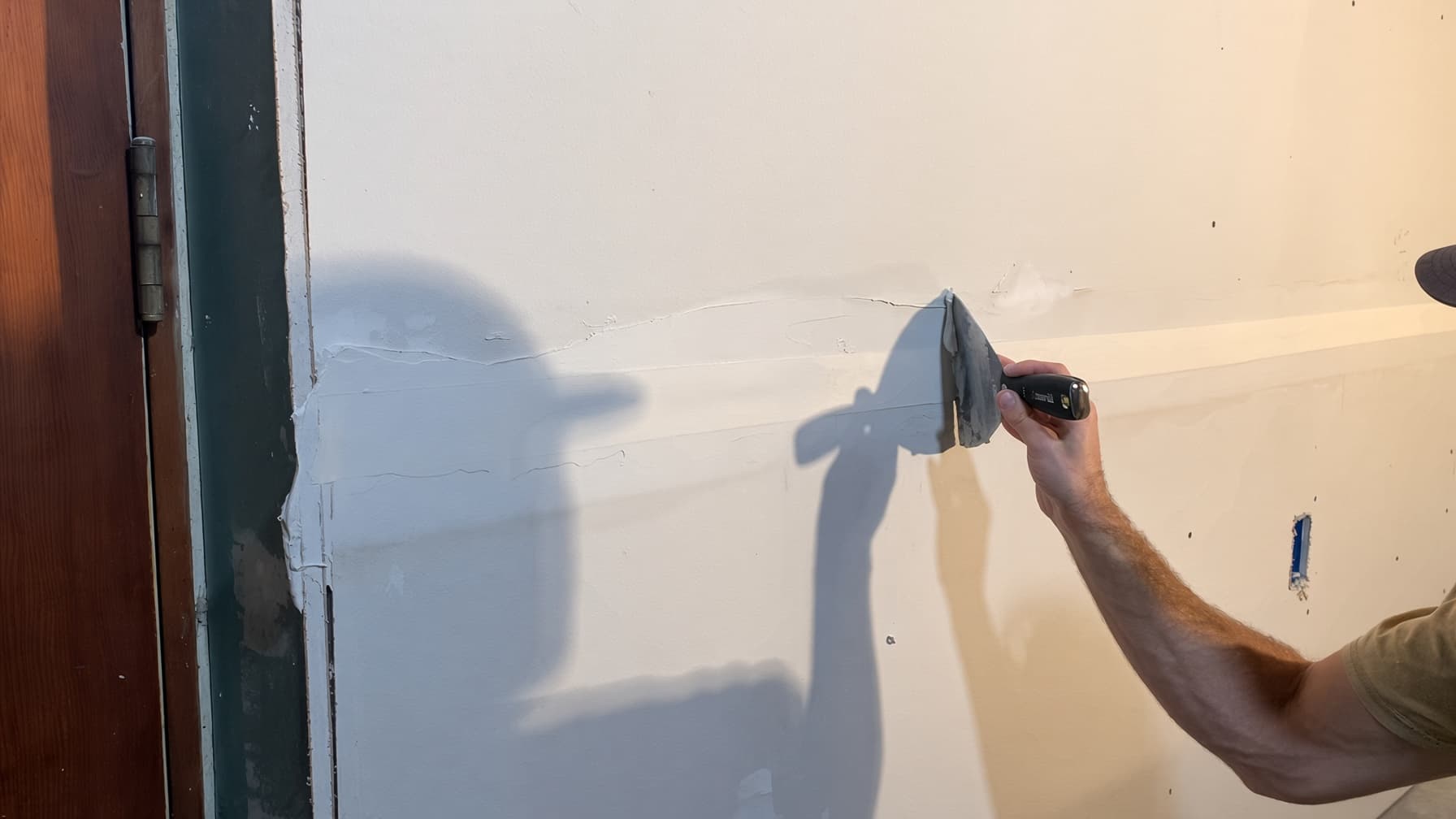 Taped and mudded drywall in a finished Colorado Springs basement