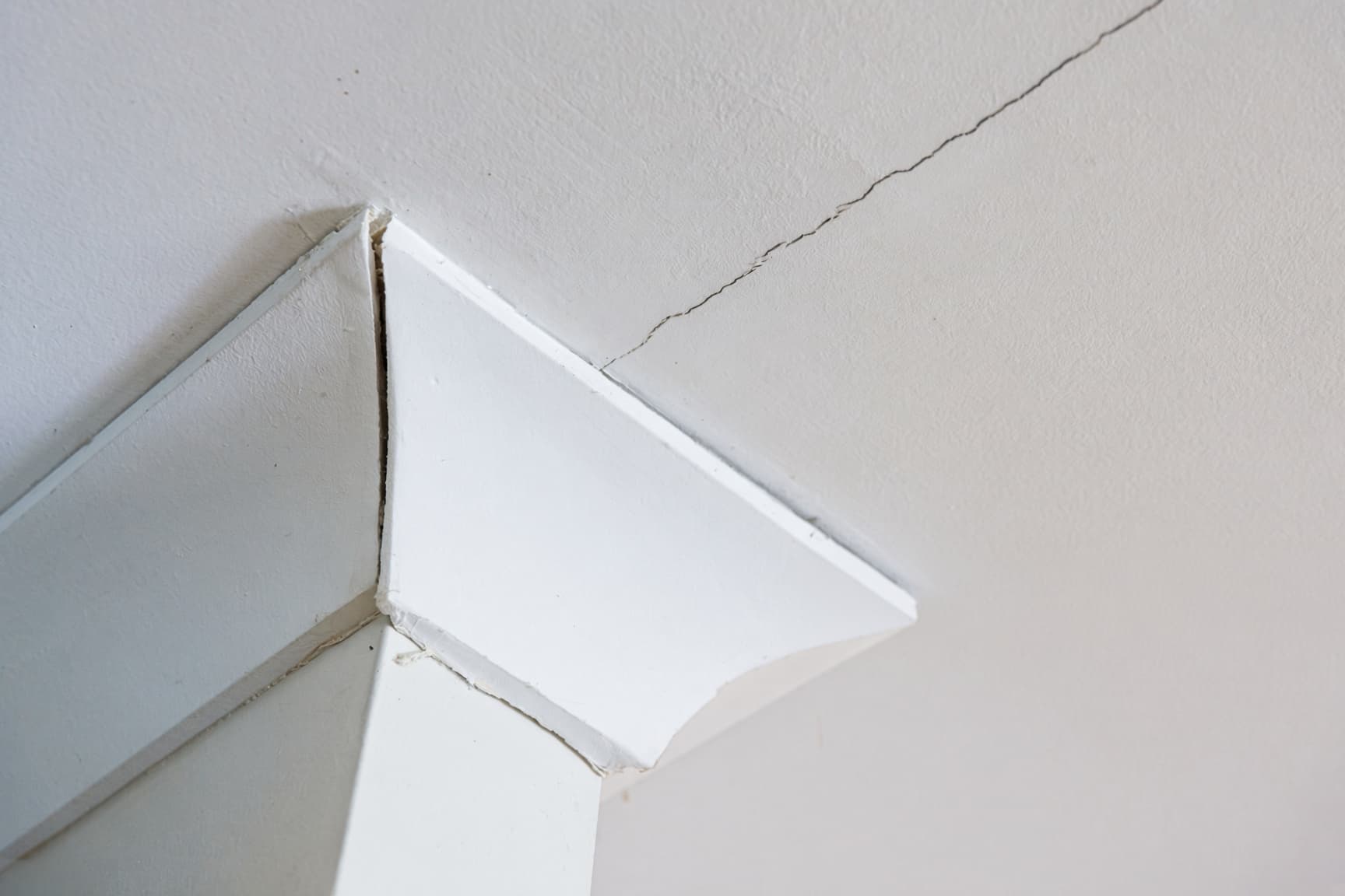 Ceiling drywall crack along a seam in a Colorado Springs two-story