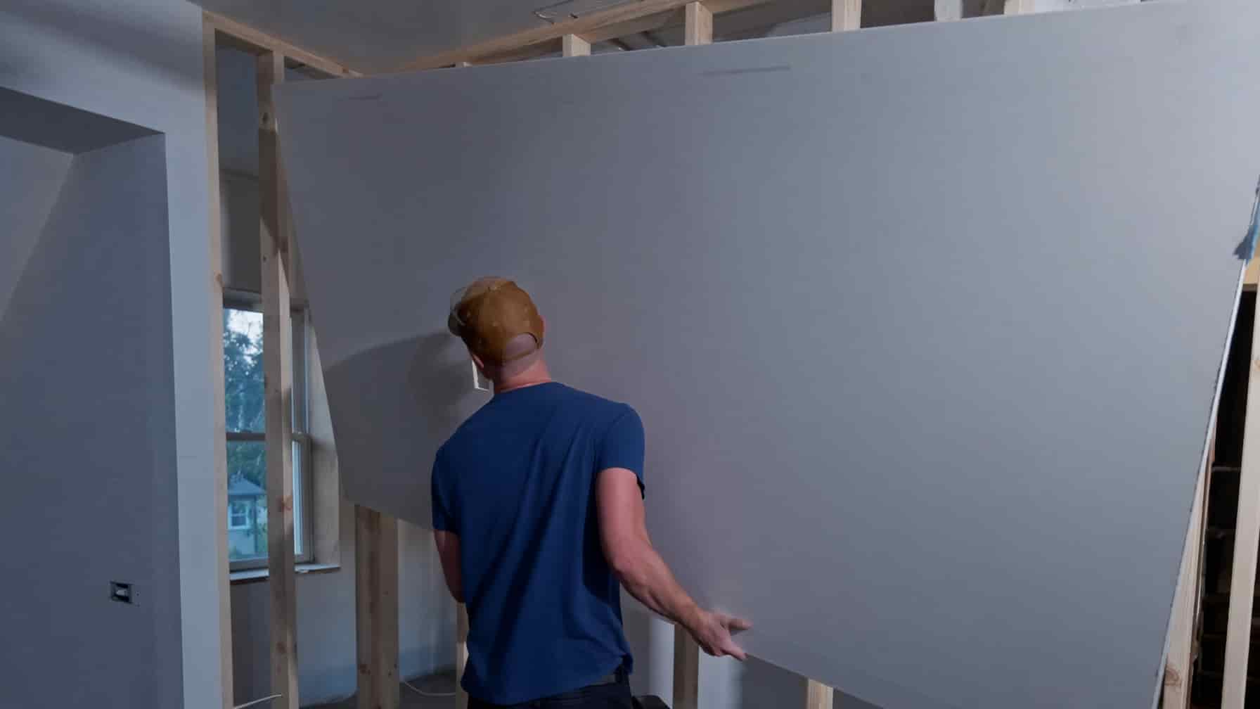 Drywall sheets stocked and being hung in a Colorado Springs home