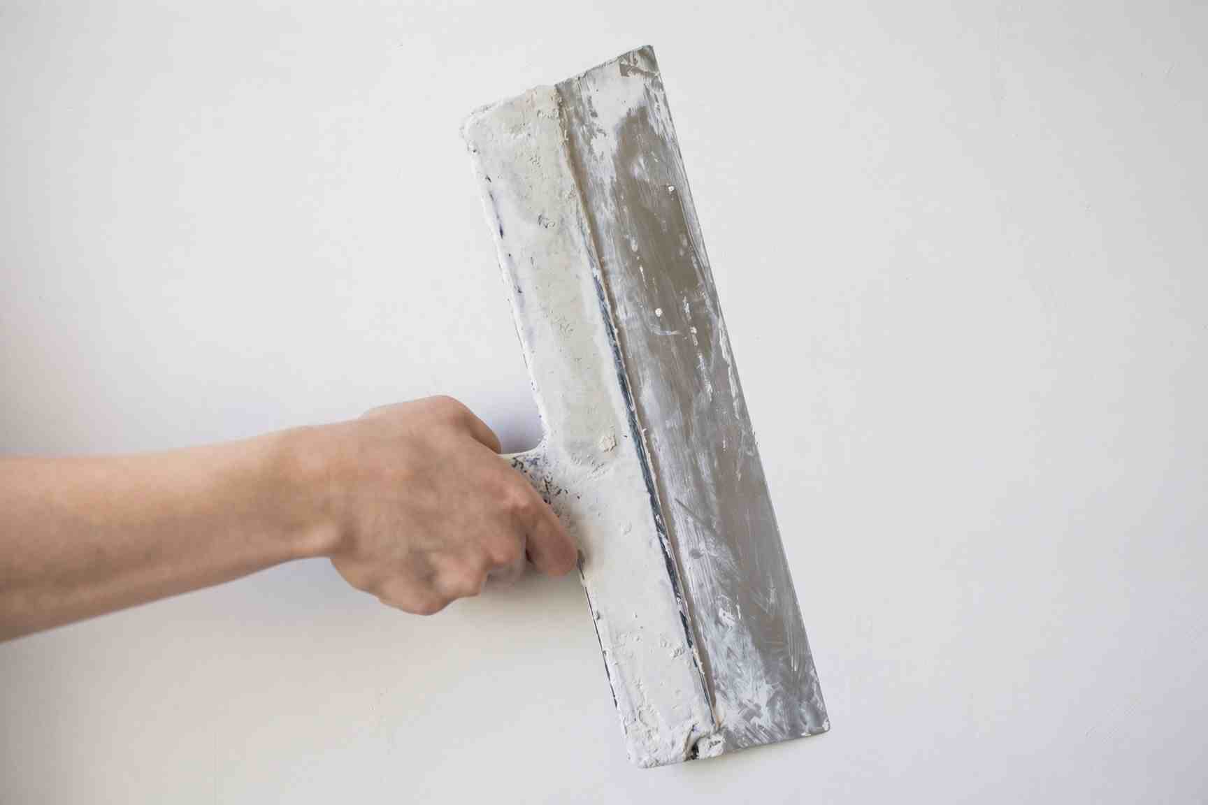 Skim coating textured walls to a smooth finish in Colorado Springs
